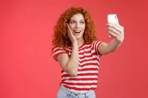 https://pixabay.com/photos/girl-woman-female-ginger-red-6920625/ Red haired girl taking selfie